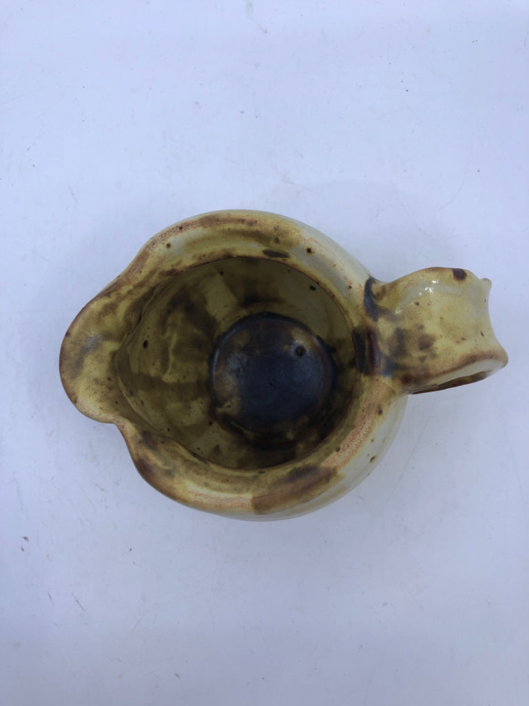BROWN AND YELLOW COW PATTERN CREAMER.