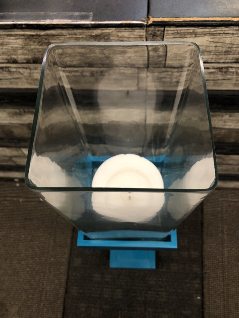 MEDIUM BLUE SQUARE BASE CANDLE HOLDER W/CLEAR GLASS TOP.
