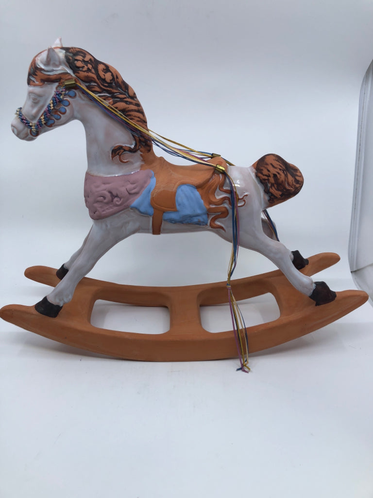 TERRACOTTA PAINTED ROCKING HORSE.