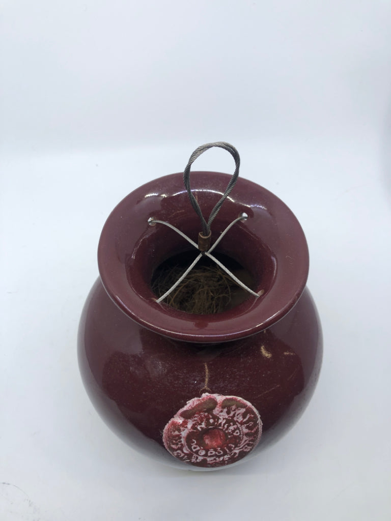 MAROON POTTERY HANGING UPSIDE DOWN PLANTER.