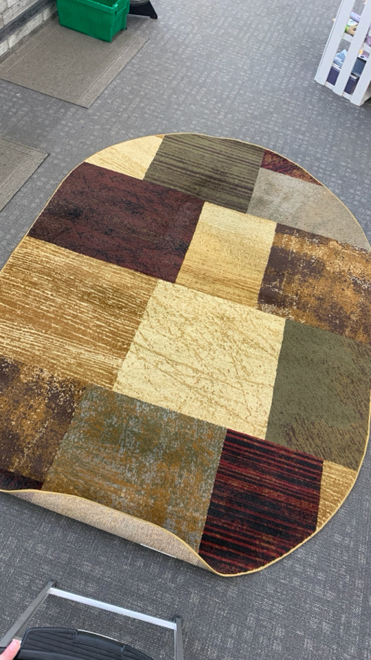 OVAL BROWN SQUARE PATTERN AREA RUG.