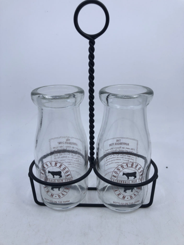 3PC DAIRY GLASS BOTTLES IN METAL HOLDER.