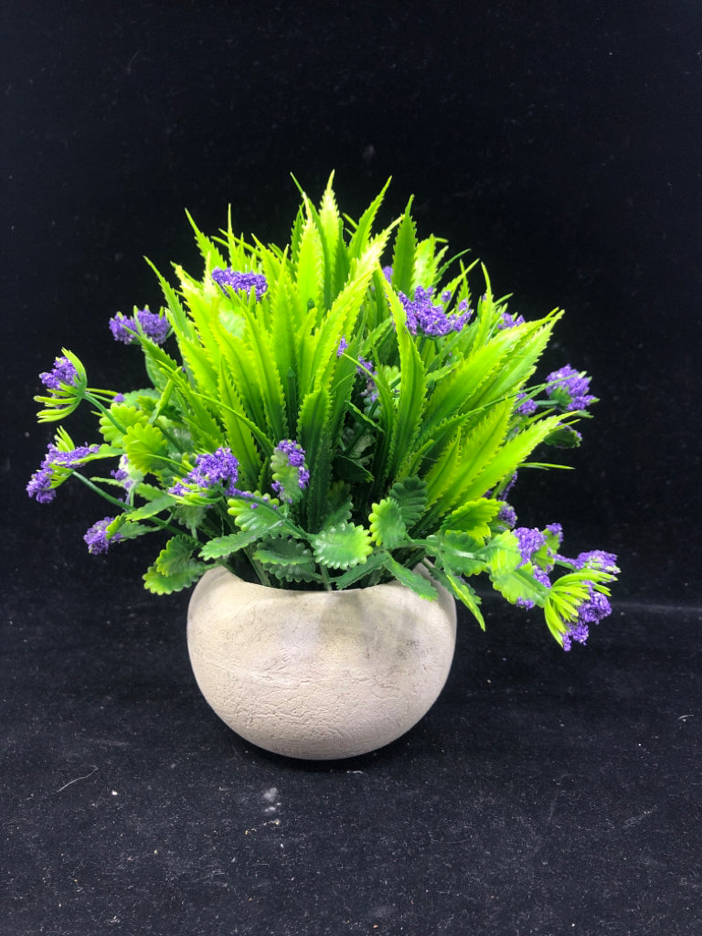 FAUX LAVENDER IN STONE PLANTER.