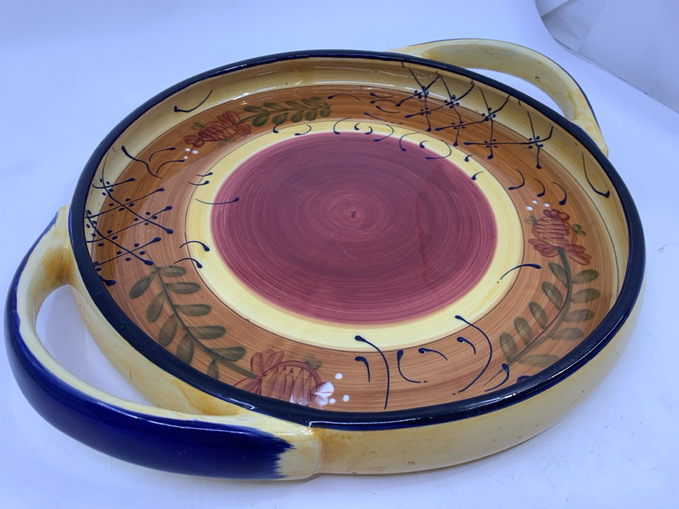 BROWN AND BLUE POTTERY DISH W HANDLES.