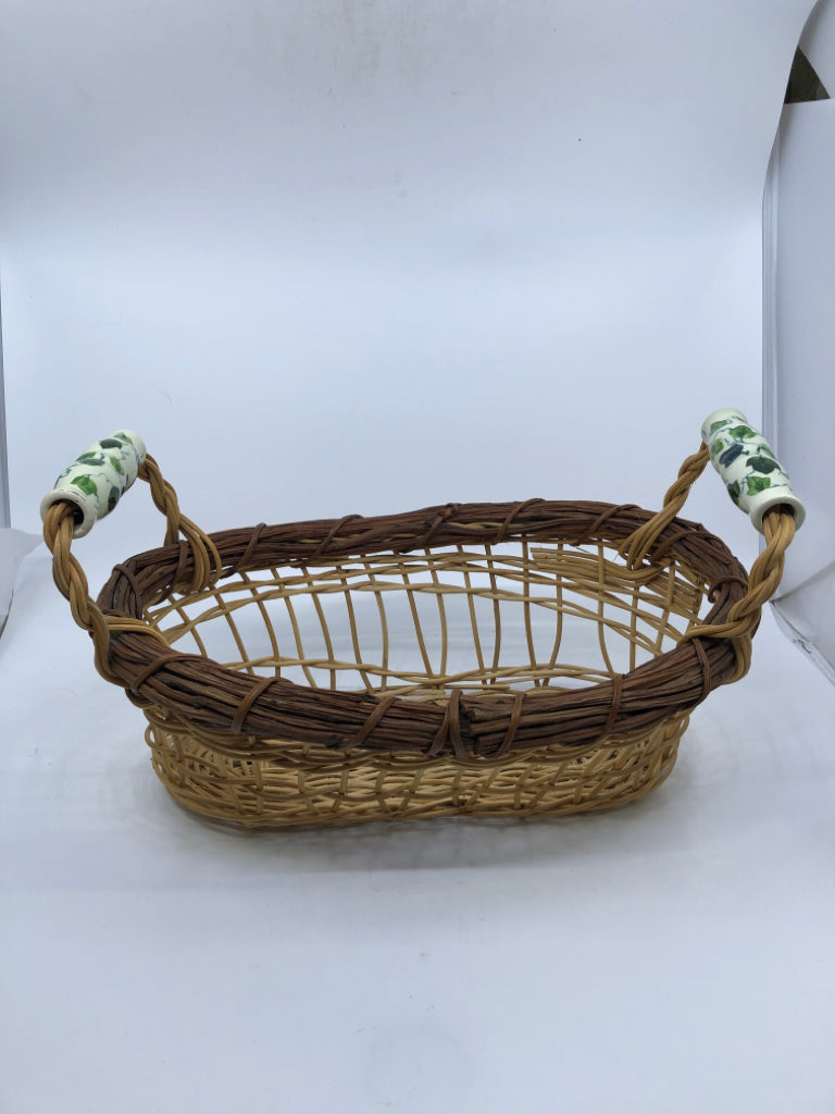 OVAL BASKET W/ CERAMIC HANDLES VINE PATTERN.