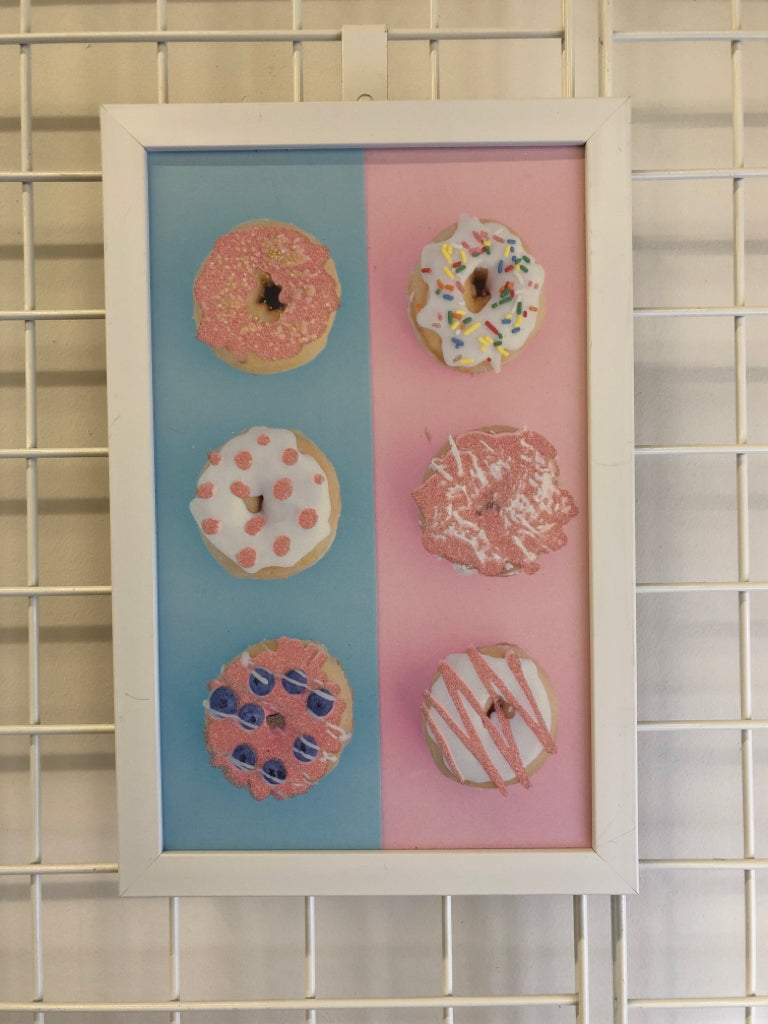 BLUE/PINK DONUT WHITE FRAME WALL HANGING.