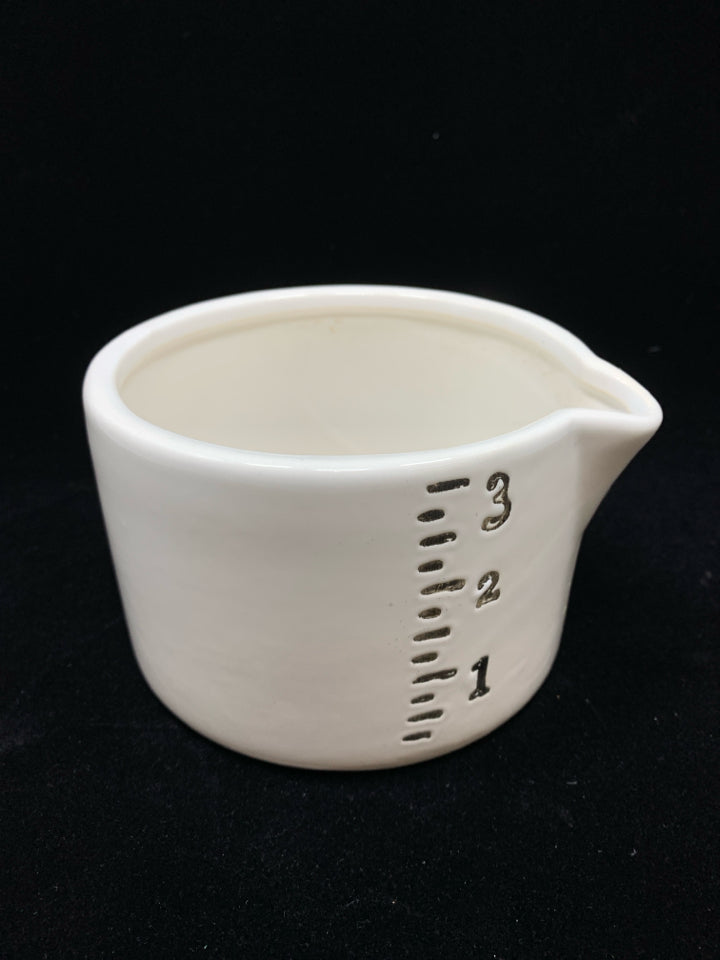 WHITE CERAMIC MEASURING PITCHER.
