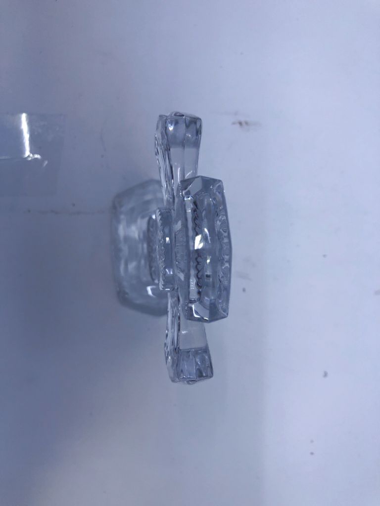 GLASS CROSS ON STAND W/ ETCHED LINES.