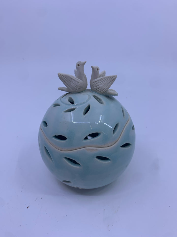 LIGHT BLUE PIERCED CANISTER W/ DOVES IN TOP.