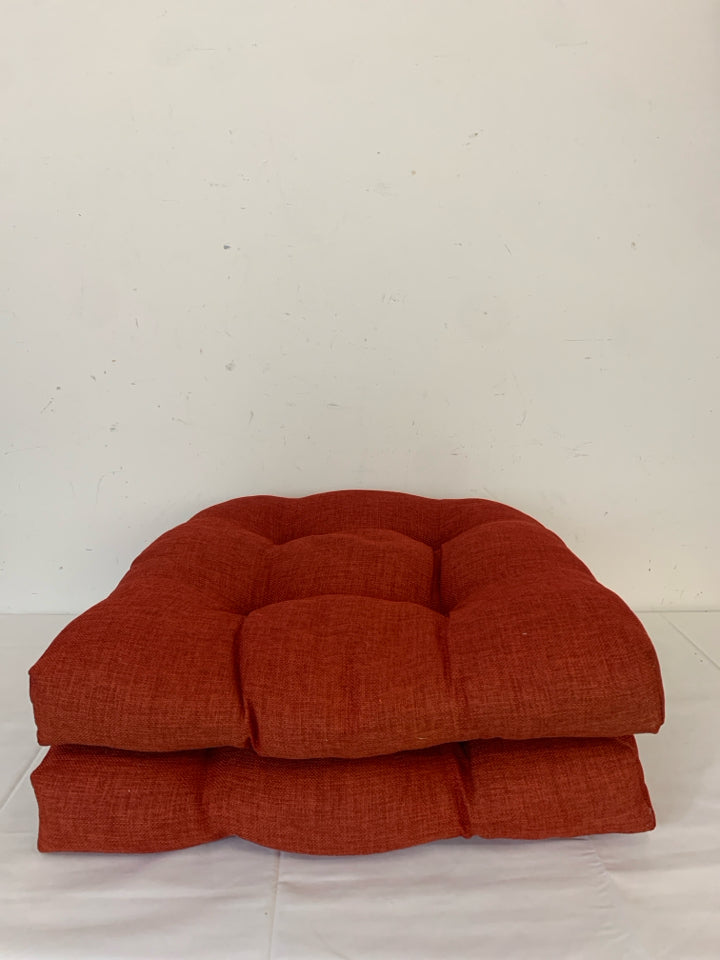 2 RED CHAIR CUSHIONS.