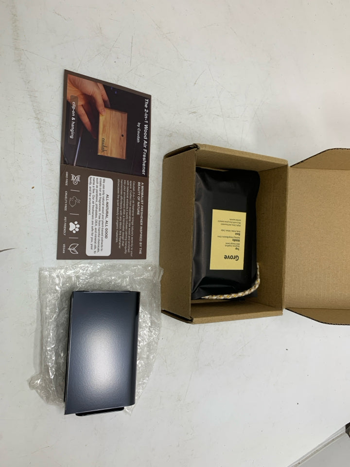 NIB NATURAL WOOD SCENT AIR FRESHENER.