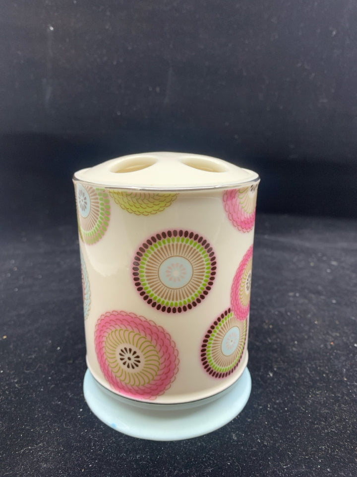 PINK AND BLUE PATTERN TOOTHBRUSH HOLDER.