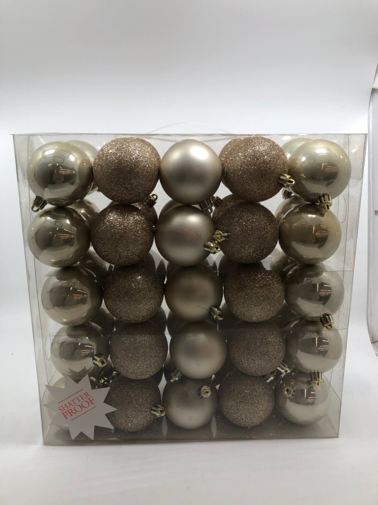 NIP 50PC ROSE GOLD ORNAMENTS.