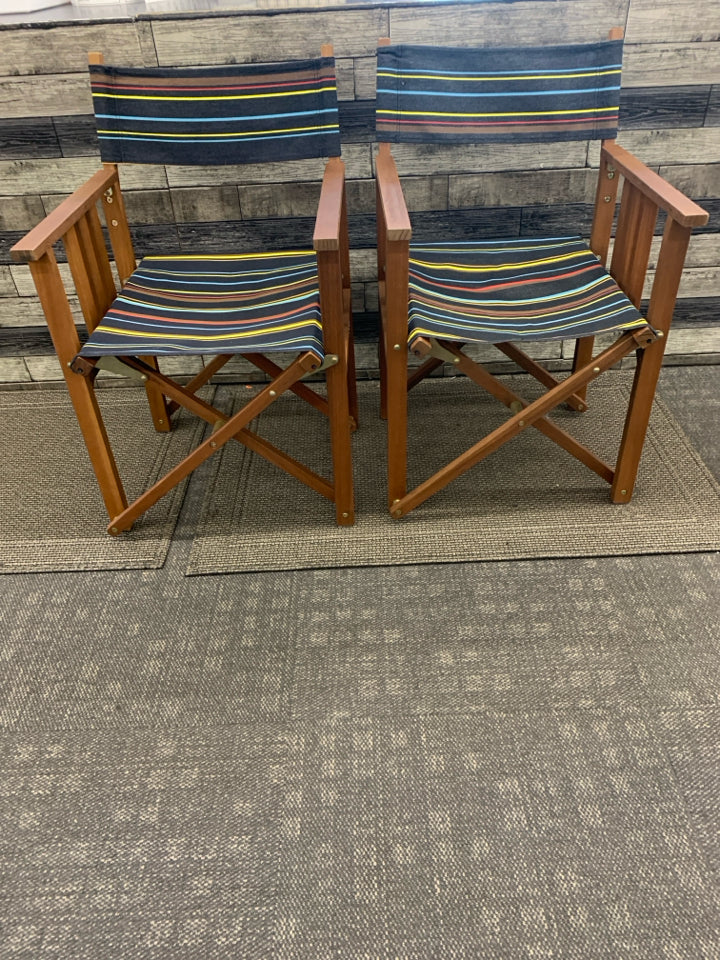 2 FOLD UP DIRECTOR CHAIRS DARK BROWN W/ COLORFUL STRIPE PATTERN.