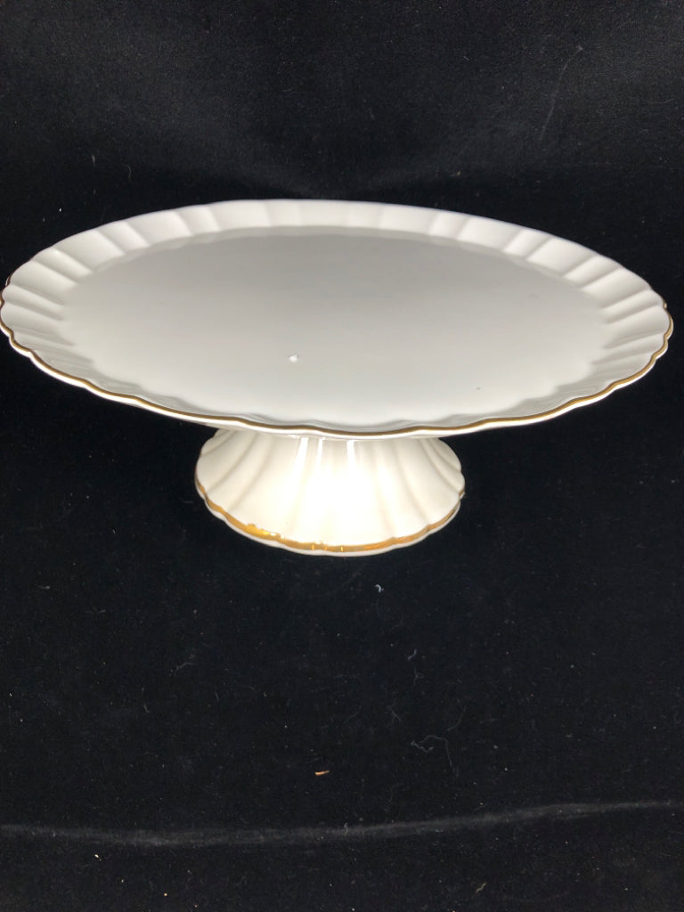 RAISED CAKE STAND W/GOLD TRIM.