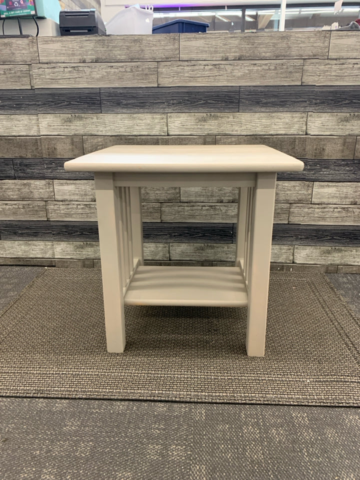 TAN BOTTOM SHELF END TABLE.