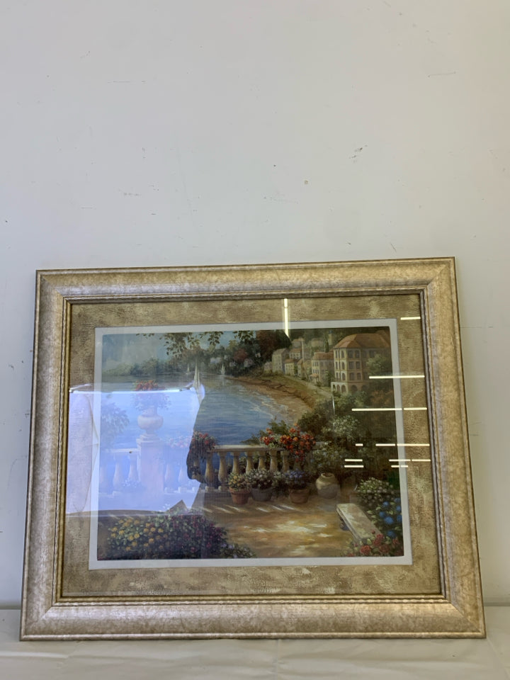 PORCH OVERLOOKING LAKE W SAILBOAT IN LIGHT GOLD FRAME.