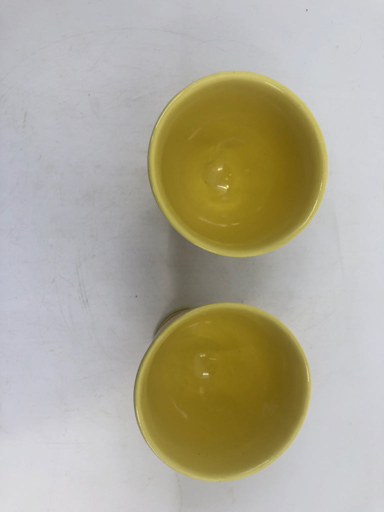 2 VTG YELLOW AND GREEN STRIPED EGG CUPS.