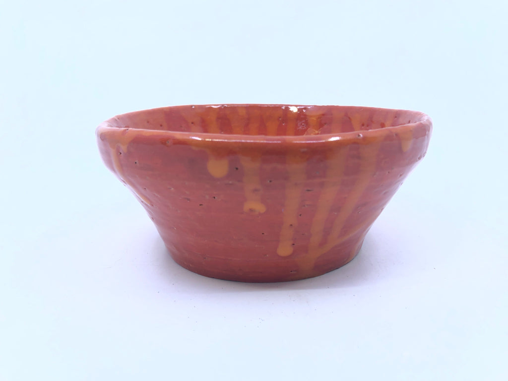 ORANGE W DRIP POTTERY DISH.