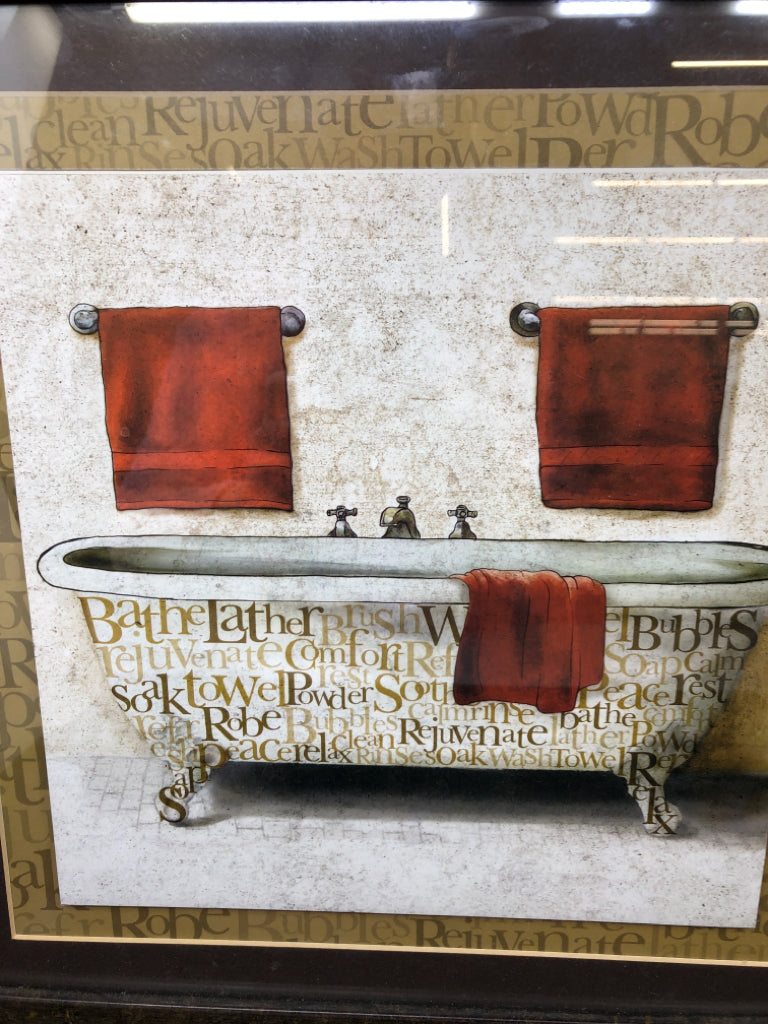 BATHTUB W WORDS AND RED TOWELS.