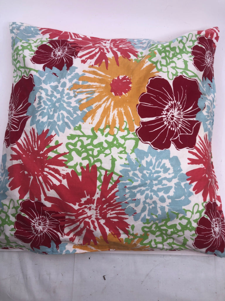 COLORFUL FLOWER W/ SOLID ORANGE BACK PILLOWS.