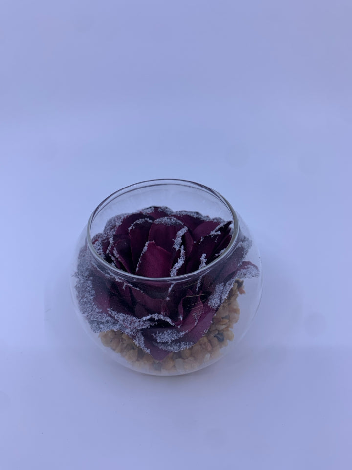 PURPLE FLORAL AND STONES IN GLASS JAR.