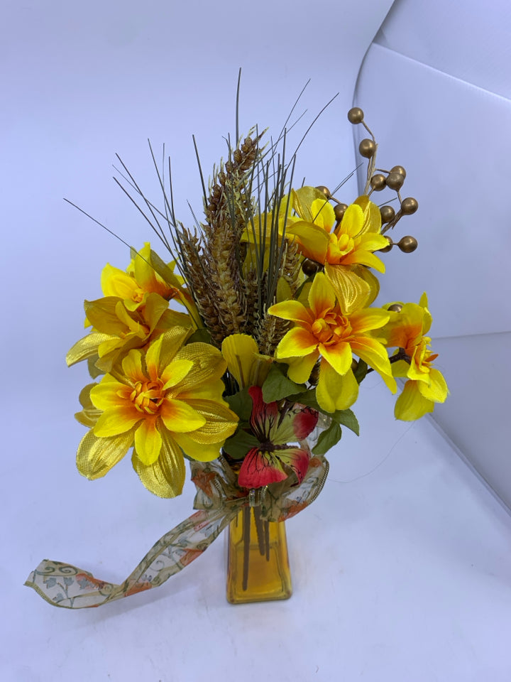 ORANGE VASE WITH FAUX SUNFLOWERS.