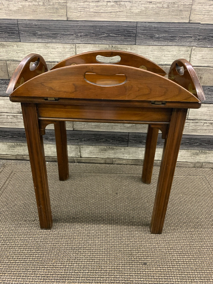 DARK BROWN RAISED EDGE ROUND TABLE.