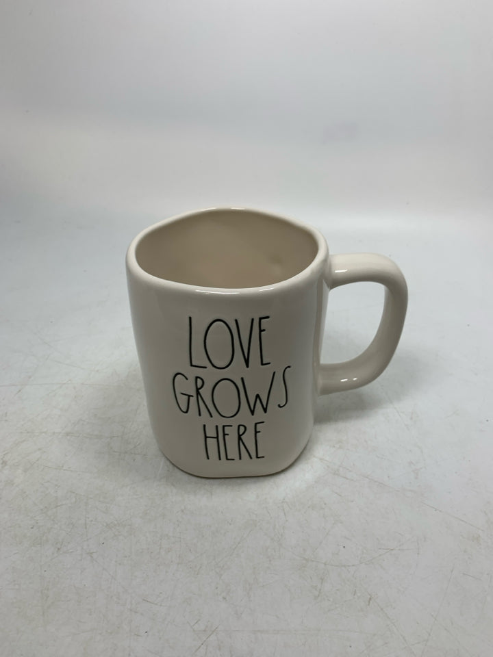 LOVE GROWS HERE MUG.