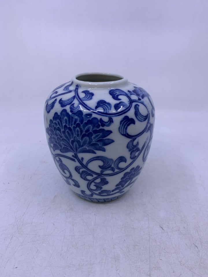 WHITE W/ BLUE FLORAL CERAMIC VASE.