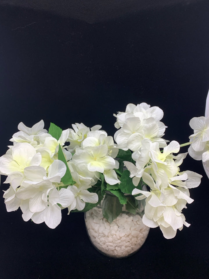 WHITE FLORAL IN ROCKS VASE.