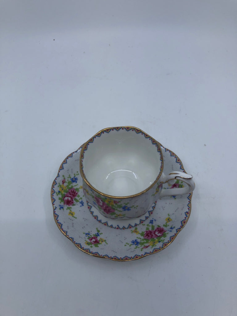 VTG PETIT POINT PATTERN W PINK ROSES TEACUP AND SAUCER.