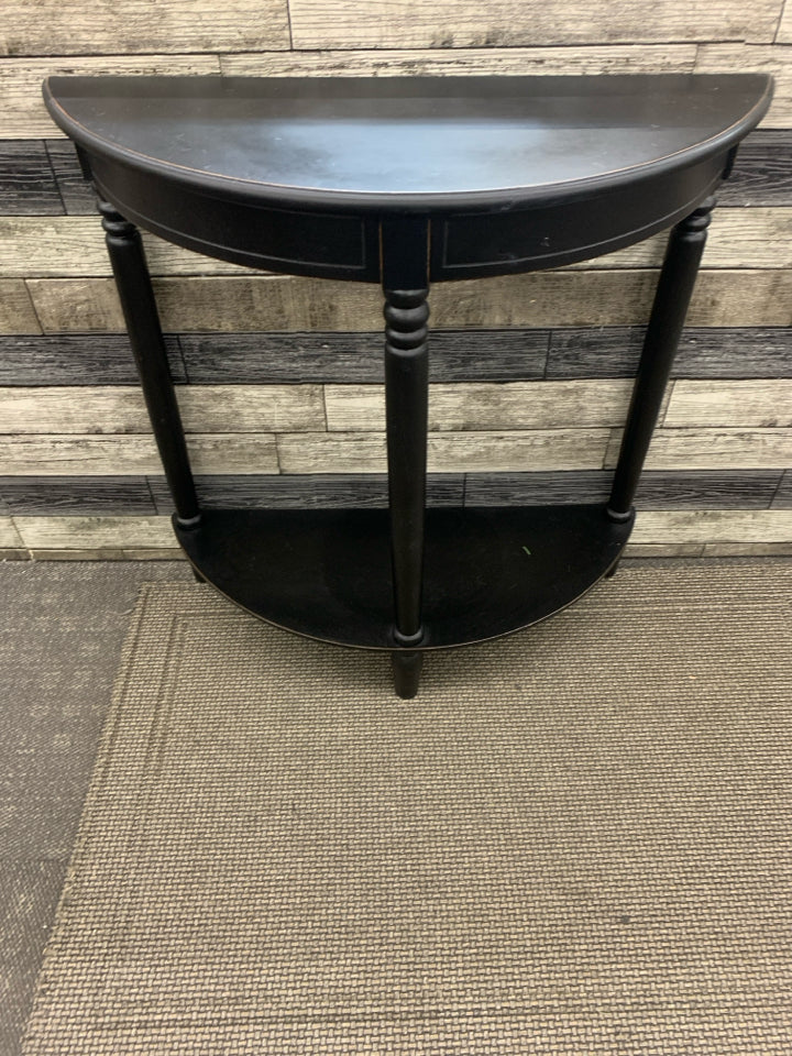 BLACK 2 TIER HALF MOON TABLE.