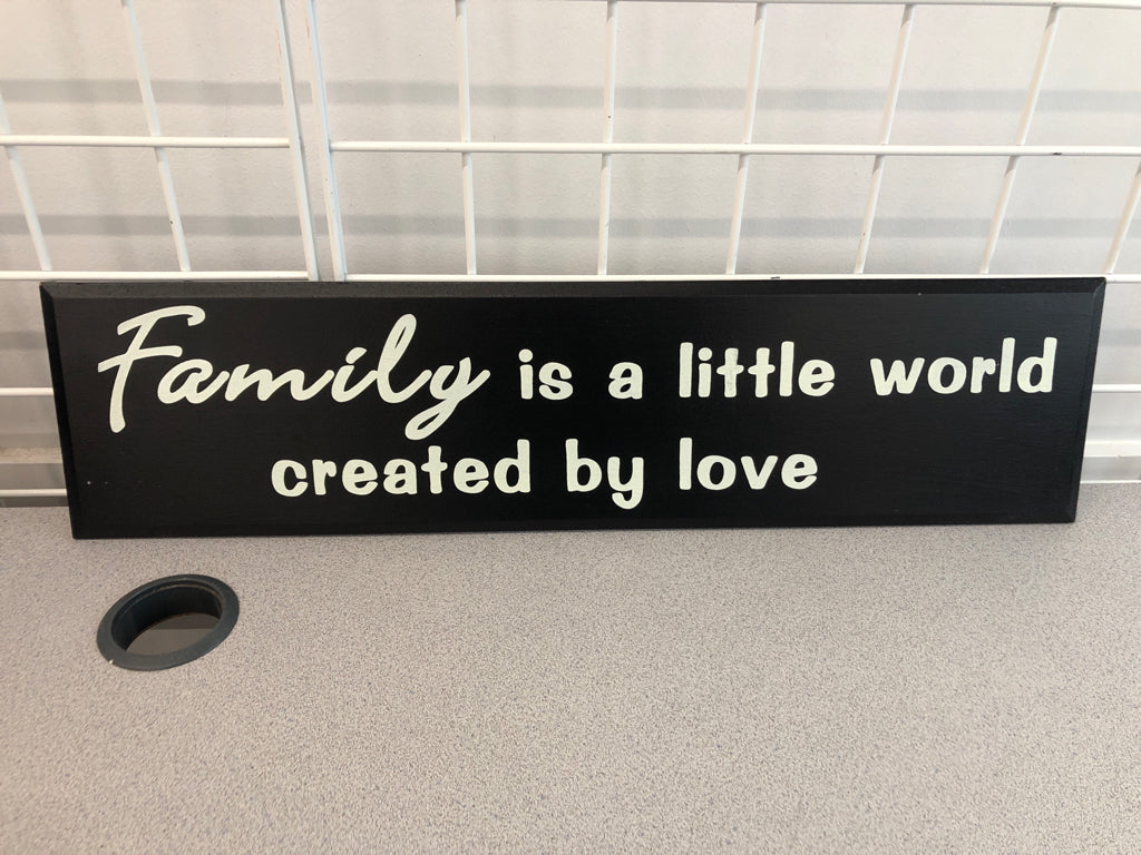 FAMILY IS A LITTLE WORLD WOOD SIGN.