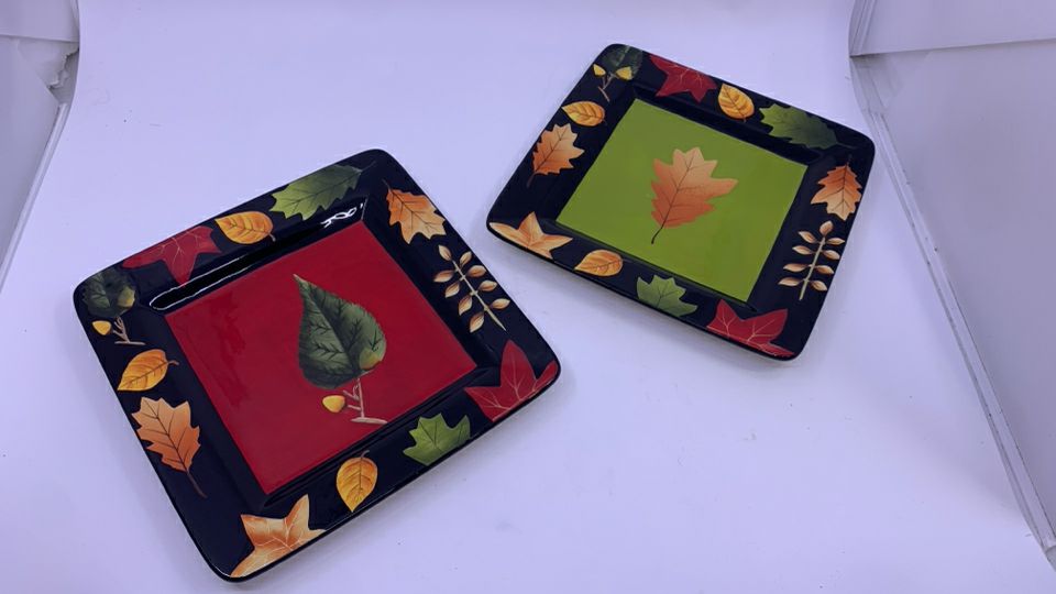 2 BLACK SQUARE LEAF PAINTED PLATES.