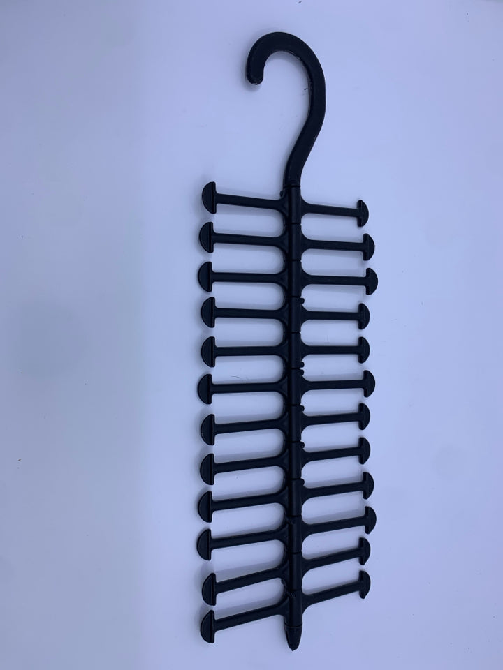 BLACK PLASTIC TIE HANGER.