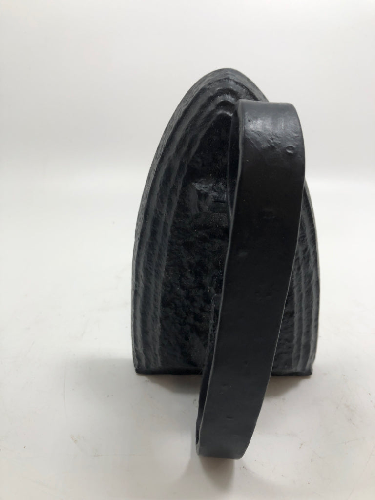 BLACK SAD IRON DOOR STOP.