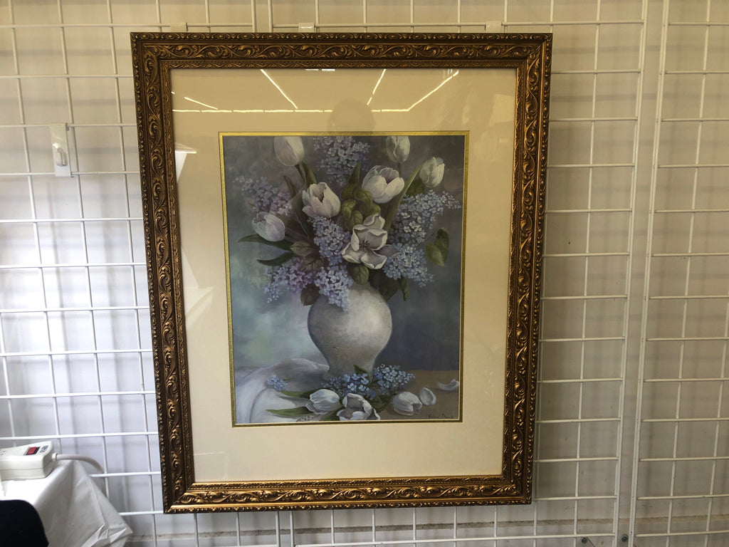 BLUE AND WHITE FLORAL IN GOLD ORNATE FRAME.