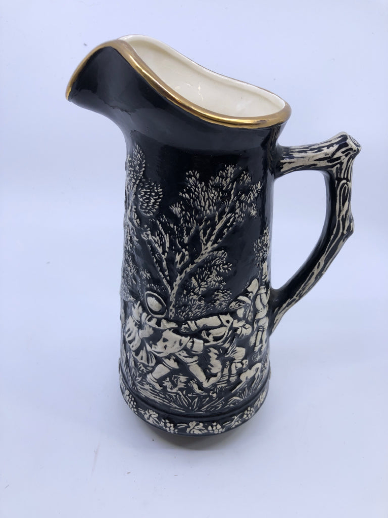 VTG BLACK W EMBOSSED PEOPLE DANCING PITCHER.