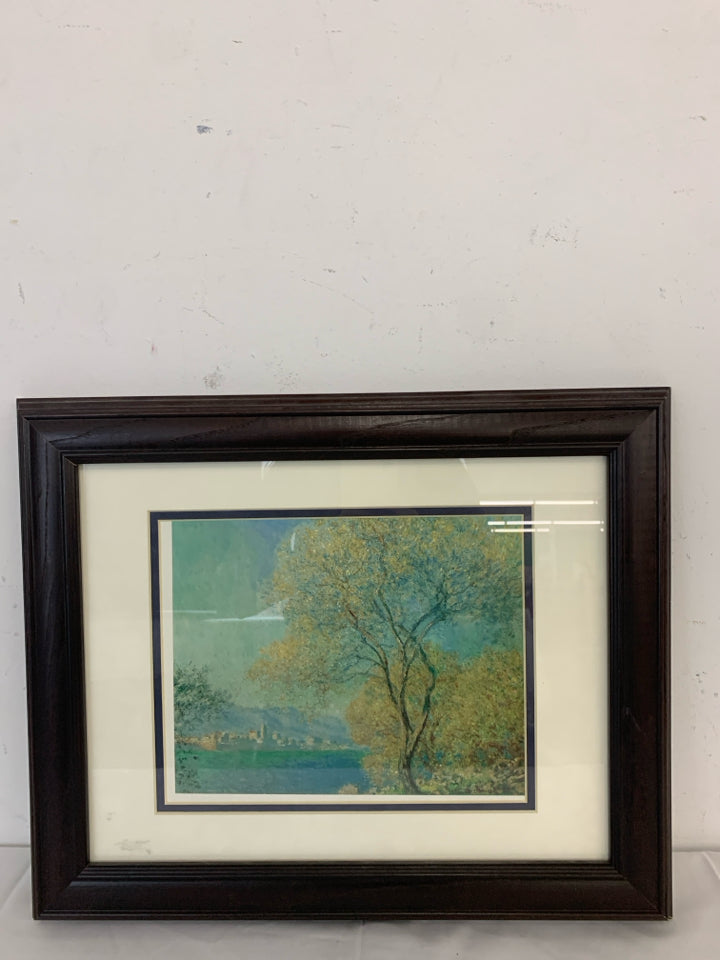 TREE CITYSCAPE WALL HANGING IN BROWN FRAME.