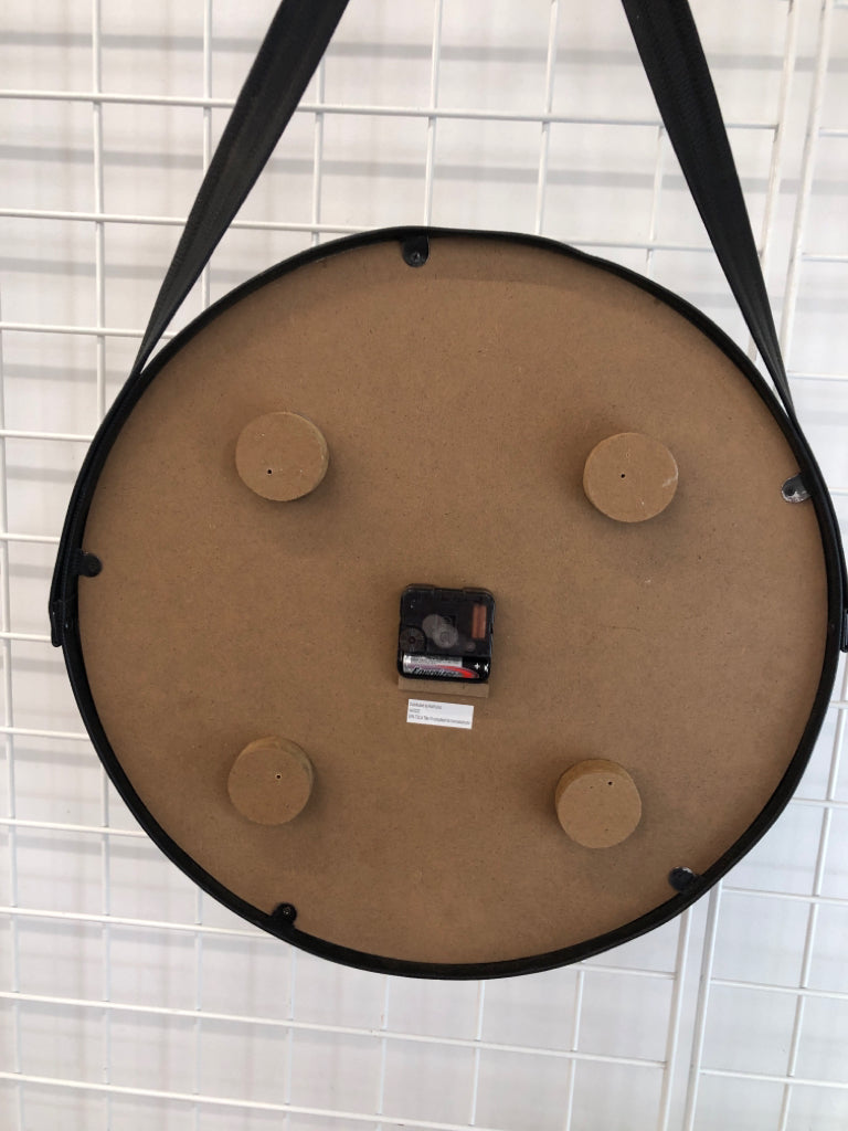ROUND WOOD CLOCK W/FAUX LEATHER FRAME AND HANGER.