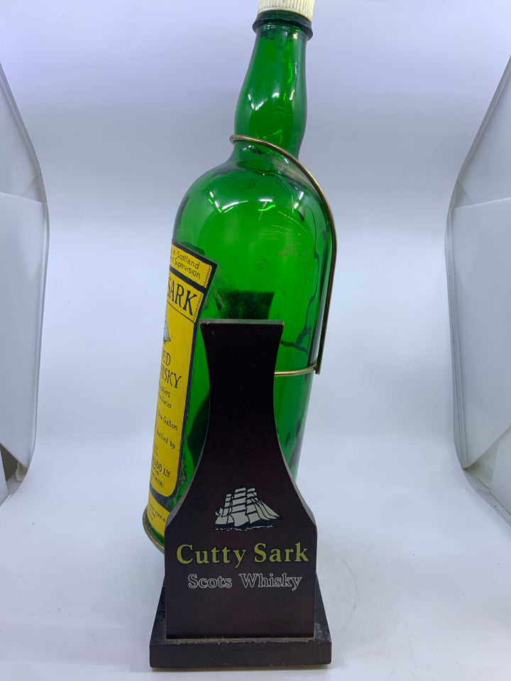VTG CUTTY SARK WHISKY DISPLAY BOTTLE W/WOODEN SWING CRADLE STAND.