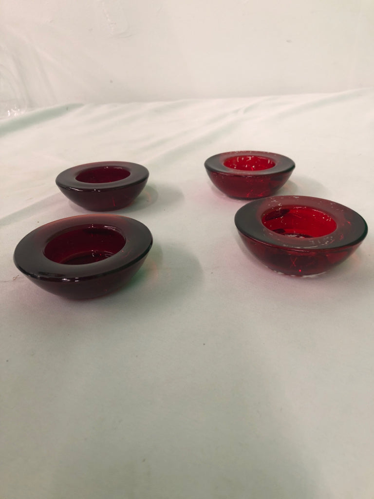 4 RED GLASS TEA LIGHT HOLDERS.