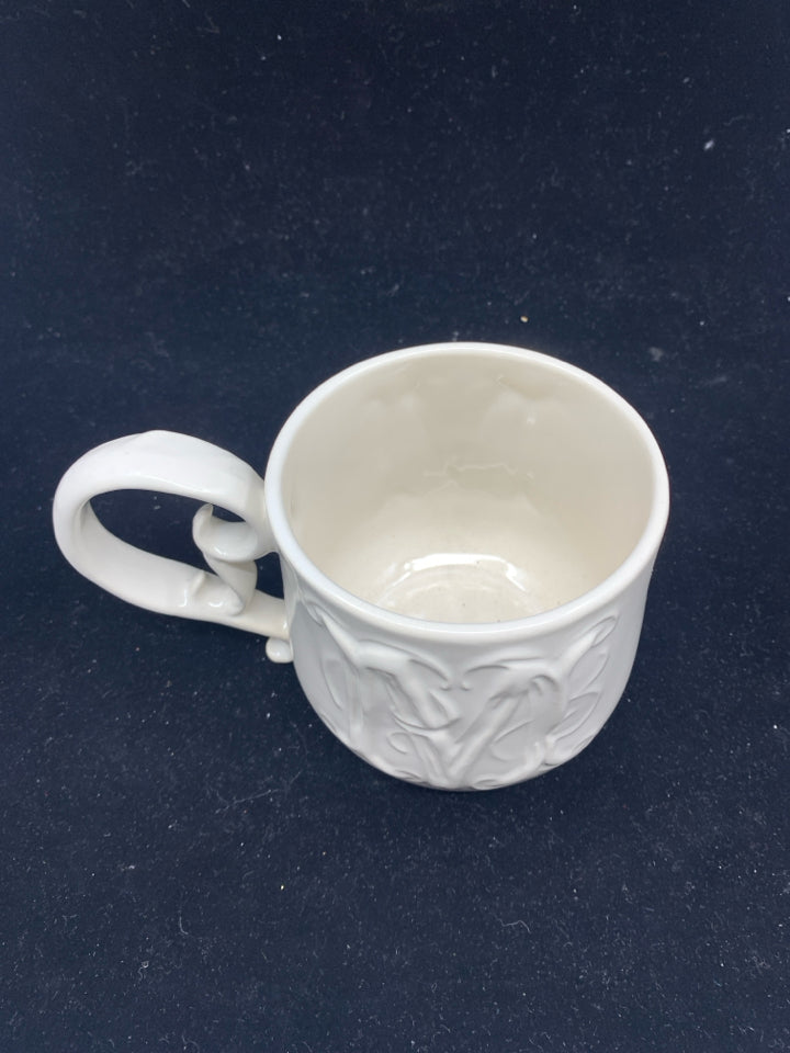 CREAM W/ FANCY HANDLE "M" MUG.