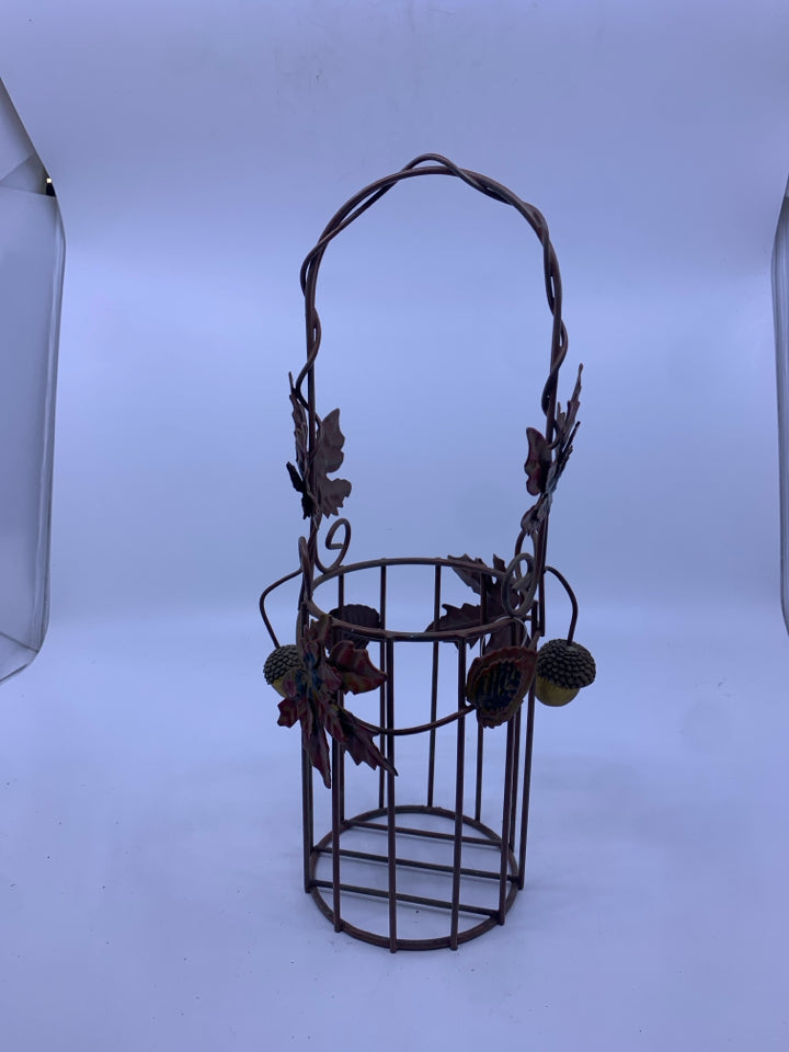 BROWN METAL WINE BOTTLE HOLDER W HANDLES AND ACORNS.