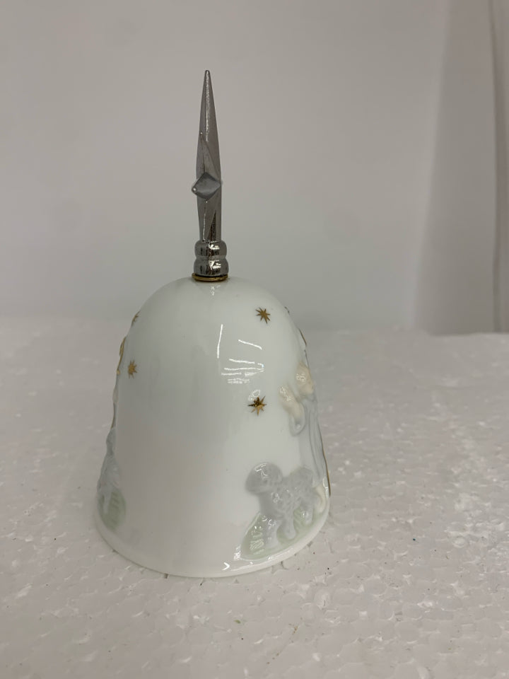 CERAMIC BELL W/ EMBOSSED BOY HERDING SHEEP METAL STAR AS HANDLE.