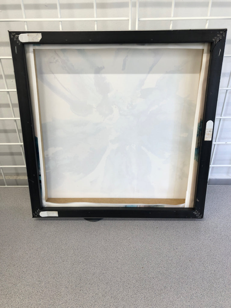 BLUE W/BLACK WATERCOLOR STYLE FLOWER ON FRAMED CANVAS.