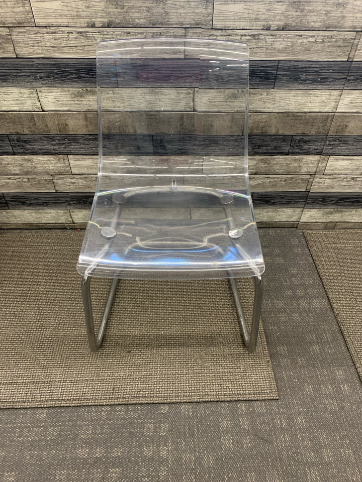 CLEAR IKEA CHAIR W/ METAL BOTTOM.