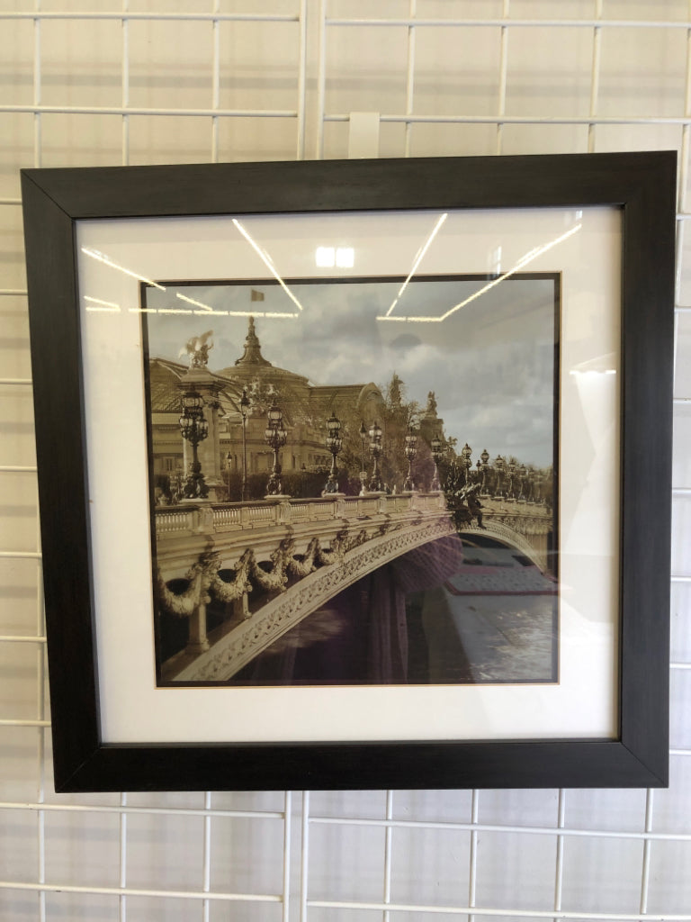 BRIDGE PHOTO IN BLACK WOOD FRAME.