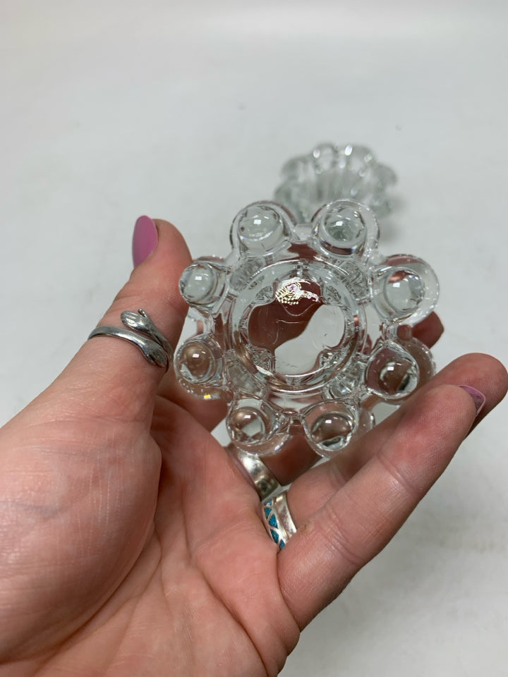 2 CLEAR GLASS TEA LIGHT HOLDERS W/ ROUNDED EDGES.